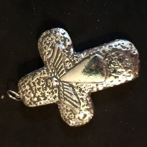 Silver tone cross pendant